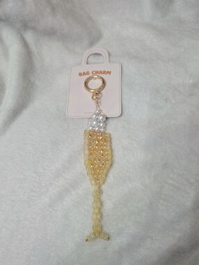 Anthropologie Champagne flute bag charm
